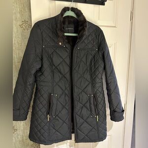 Worn maybe once or twice, faux fur lined, black quilted jacket